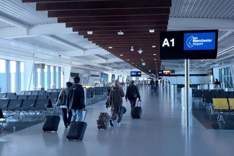 How do I talk to a live person at Manchester Airport? logo